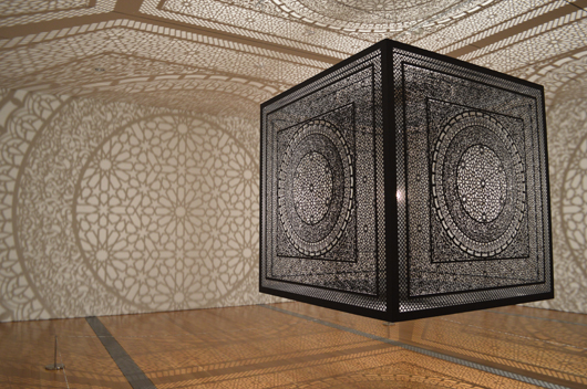 Anila Quayyum Agha of Indianapolis won the Juried Grand Prize and the Public Vote at ArtPrize for 'Intersections,' a 6-foot carved cube that casts intricate shadows throughout a room. Image courtesy of ArtPrize.