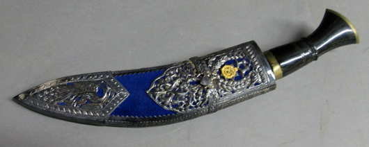 Regimental silver mounted Gurkha kukri with Royal Cypher of Queen Elizabeth II; rear pouch contains two horn-handle knives. Sterling Associates image