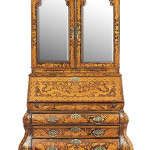 This 19th century Dutch walnut secretary with inlay sold for $2,214 at New Orleans Auction Galleries. It is an example of the bargains that are now seen at auctions because of the drop in prices of what the trade calls 'brown furniture.'