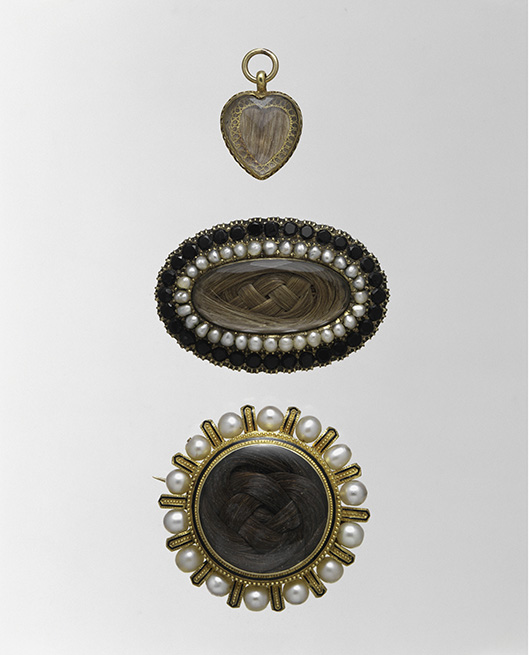 Victorian era mourning jewelry. Center: gold, jet, pearls and hair. The Metropolitan Museum of Art, Purchase, Susan and Jon Rotenstreich Gift, 2000 (2000.557). Bottom: Tiffany & Co. brooch, 1868, gold, pearls, black enamel and hair. The Metropolitan Museum of Art, Purchase, Susan and Jon Rotenstreich Gift, 2000 (2000.556). Photo: © The Metropolitan Museum of Art