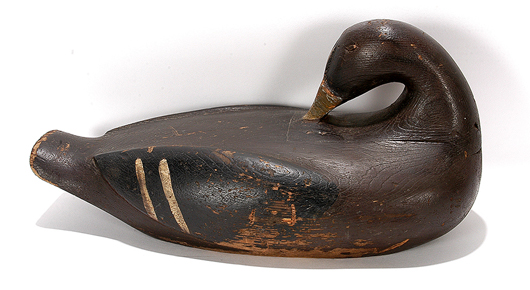 Augustus ‘Gus’ Aaron Wilson, ‘Rare Sculpture Back Preening Elder’ c. 1900-1920s. Early wide body with inletted neck and original paint. Carved and painted wood, 16in. x 9in. x 7 1/2in. Est. $8,000-12,000. Slotin Auction image.
