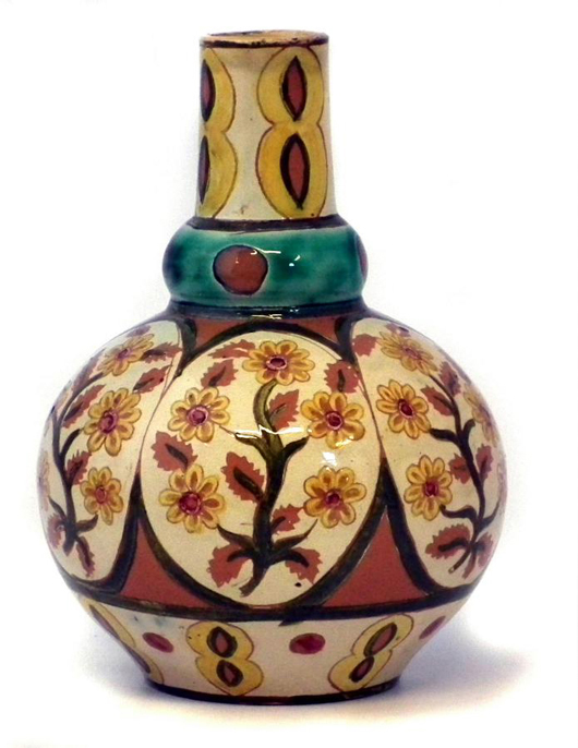 A Della Robbia bottle vase dated 1896 incised and painted with floral patterns by Lizzie Wilkins and signed 'Lizzie'. It is estimated at £600-800. Photo by Peter Wilson