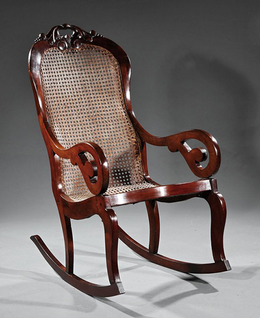 A West Indies carved mahogany and caned rocking chair, 19th century. Reference: Conners, Michael. 'Caribbean Elegance,' 2002. p. 46, fig. 34. A pair of these rockers sold at auction in New Orleans last year for $4,305. Image courtesy of Neal Auction Co.