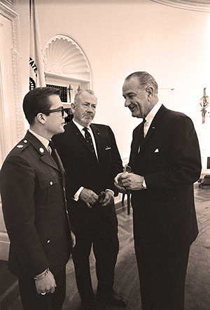 Author John Steinbeck, with his 19-year-old son John (left), visits his friend, President Lyndon B. Johnson, in the Oval Office, May 16, 1966. John Jr. is shortly to leave for active duty in Vietnam. Image courtesy of Wikimedia Commons.
