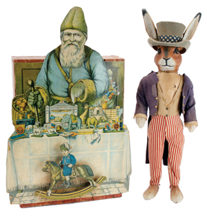 Animated Santa in toyshop window display, 24in tall, est. $1,500-$2,000; and patriotic rabbit candy container, 24in tall, cloth dressed over papier-mache, est. $2,000-$2,500. Noel Barrett image