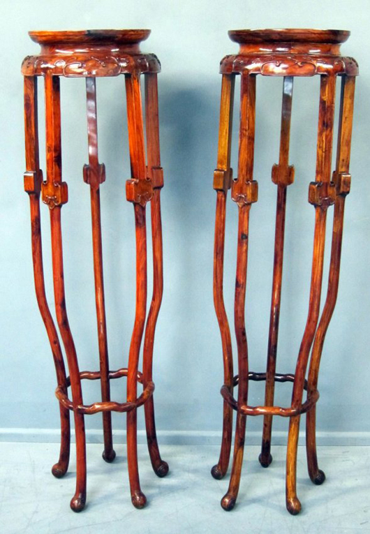 These huanghuali plant stands, sold for £4,800. Photo Ewbank’s auctioneers