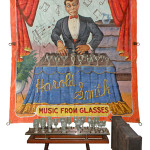 1940 Fred Johnson banner of Howard Smith, plus an original Victorian water harp, or water harmonica. Mosby & Co image