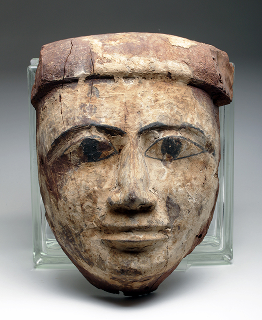 Oversized Egyptian wood mummy mask, 21st/26th Dynasty, circa 1075-600 BCE.  Pre-1970 provenance. Est. $2,000-$4,000. Artemis Gallery image