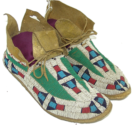 Early 1900s pair of sinew sewn and lazy stitch Arapaho beaded hard-soled moccasins, with only minor bead loss. Price realized: $1,840. Allard Auctions Inc. image