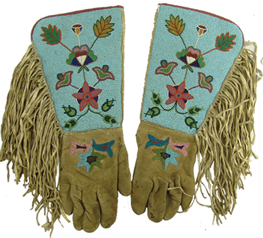 Outstanding pair of fancy parade gloves, or gauntlets, with extended beaded tops having fine floral motifs. Price realized: $2,587. Allard Auctions Inc. image