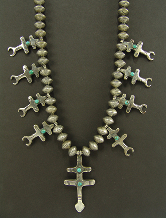 Circa 1970s all-silver squash-style cross Pueblo necklace with sand cast features and turquoise stones. Price realized: $1,840. Allard Auctions Inc. image