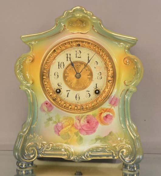 Ansonia 'La Fontaine' porcelain mantel clock in Royal Bonn case, signed on back, time and strike, circa 1895, est. $300-$550. Bruhns image