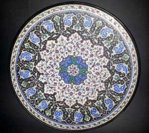 Persian enamel and silver plate, 7.75in. diameter. Estimate: $300-$500. Tonya A. Cameron Auctions image