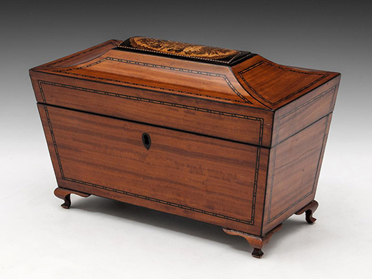 A satinwood sarcophagus-shaped tea caddy with an unusual Tunbridgeware panel to its lid, circa 1850. Price: £495 ($777). Photo: Hampton Antiques