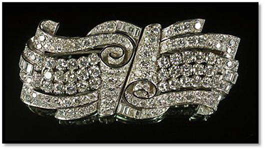 Spectacular platinum and diamond set Art Deco double clip brooch, circa 1940s. The brooch splits so form two separate clips. Estimate: £6,000-£9,000 ($9,396-$14,094). Roseberys image