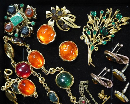 Collection of very nice costume jewelry with colored stones, comprising pins, pendants, necklaces, earrings and other forms; est. $100-$200. Sterling Associates image
