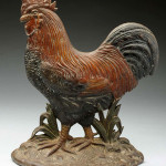 Spencer 11-1/8 inch double-sided cast-iron rooster doorstop with intricately detailed feathers and comb, est. $5,000-$7,000. Morphy Auctions image