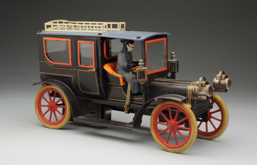 Early, hand-painted Carette clockwork limousine with beveled-glass windows and opening doors, est. $3,000-$6,000. Morphy Auctions image