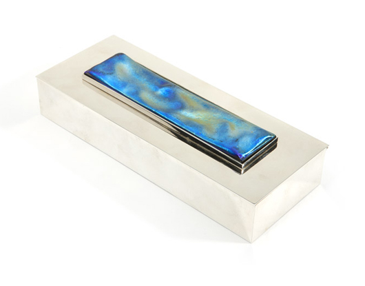 Inset with a rectangular swath of iridescent blue art glass, this elegant sterling silver Tiffany & Co. box performed within the estimated $1,500 to $2,000 range, realizing $1,800. John Moran Auctioneers image