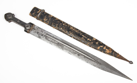 Antique Ottoman or Persian dagger. Length inserted into sheath: 28in. (71 cm). Estimate: $800-$1,200. Material culture image