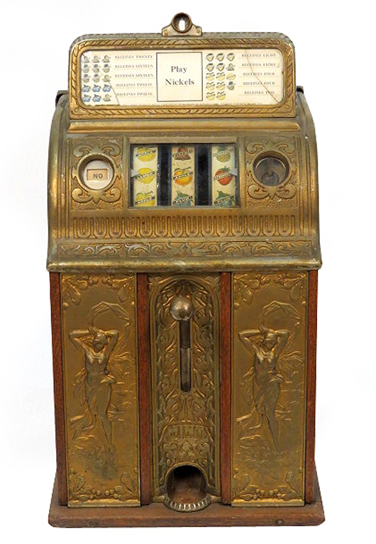 Antique slot machine with cast metal Art Nouveau panels on front, in working condition. Sold for $7,962. S & S Auctions Inc. image