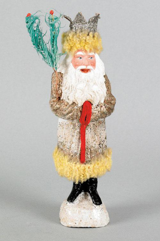 An unusual crowned Belsnickle, early 20th century, with yellow flocked trim sold at auction by Pook & Pook in October 2010 for $3,800. Photo courtesy Pook & Pook.