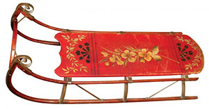 Child's sled decorated with hand-painted flowers and original red paint. Image courtesy LiveAuctioneers.com archive and Rich Penn Auctions.