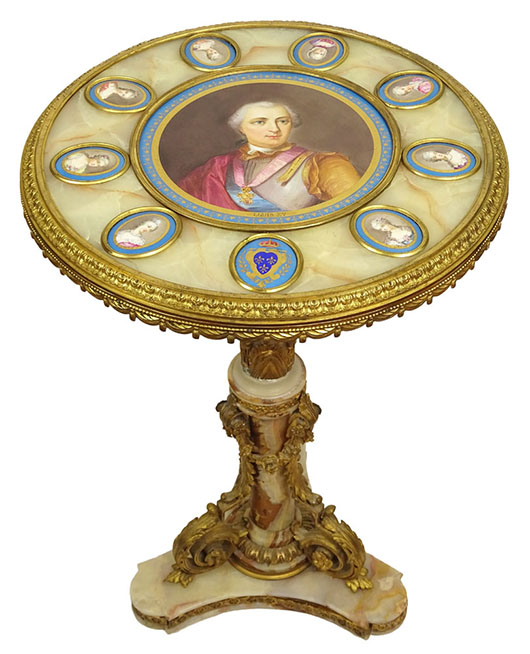 Late 19th century French gilt bronze mounted onyx pedestal guéridon, the top mounted with Sevres porcelain portrait plaques depicting Louis XV and ladies of his court. Price realized: $17,700. Kodner Galleries image.
