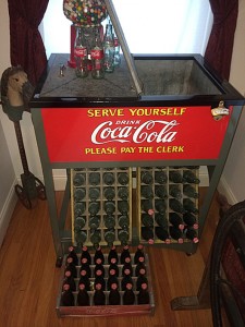 Vintage Coca Cola cooler, professionally restored in mint condition, circa 1930s, used in general stores before there was electricity in rural areas. Ice blocks kept the drinks cold. Tim’s Inc. Auctions image