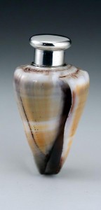 This shell is over 100 years old and has been turned into a perfume bottle with the addition of a silver topped vial set in its central core. It has a saleroom value of £400-£600. Photo: Woolley & Wallis Auctioneers