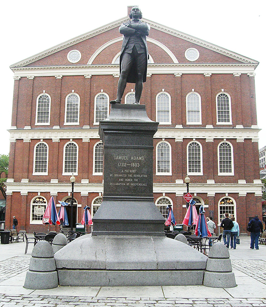 A statue of Samuel Adams stands in front of historic Faneuil Hall in Boston. Adams was governor of Massachusetts when he and Paul Revere placed the time capsule in the cornerstone of the statehouse in 1795. Image by IlliniGradResearch. This file is licensed under the Creative Commons Attribution-ShareAlike 2.5 Generic license.
