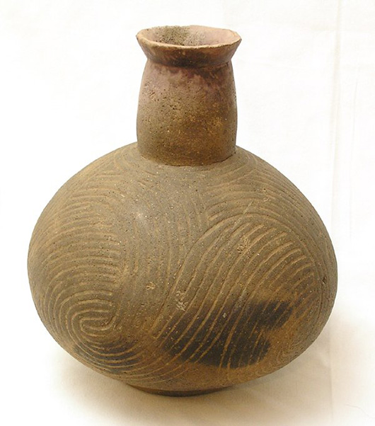 An example of a highly engraved Caddo pottery vessel found in Arkansas, but not one of the stolen items. Image courtesy of LiveAuctioneers.com archive.