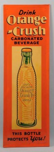 1938 Orange Crush embossed tin sign with image of ridged, 1920-patent-date bottle, 54 inches tall, est. $800-$1,500. Morphy Auctions image