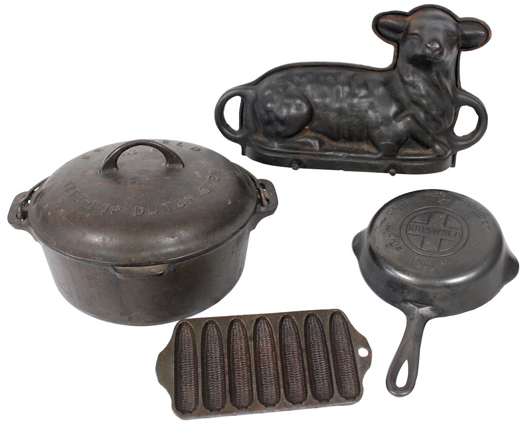 Cast-iron kitchenware including a Griswold No. 8 Tite-Top dutch oven, No. 702 skillet, No. 262 Crispy Corn stick pan and an unmarked lamb cake mold. Image courtesy of LiveAuctioneers.com archive and Rich Penn Auctions.