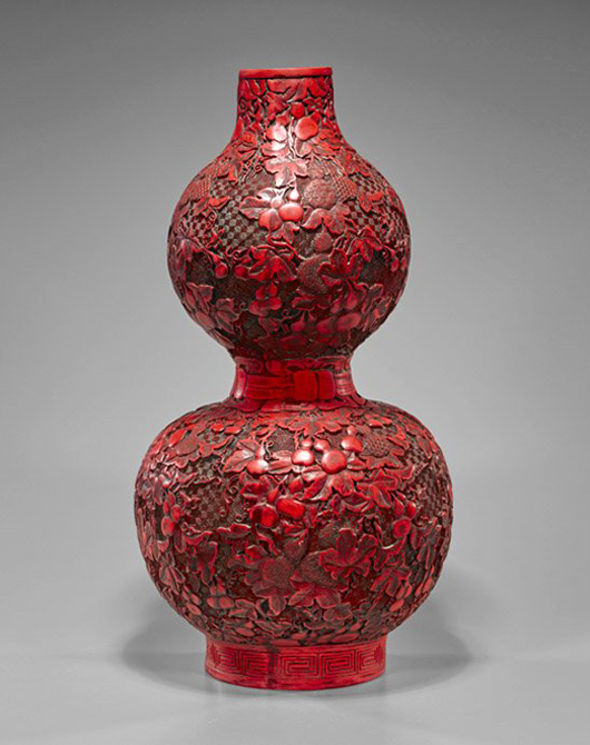 Tall Chinese red lacquer-like composite vase with seal mark, 19in. high. Estimate: $600-$800. I.M. Chait Gallery / Auctioneers image