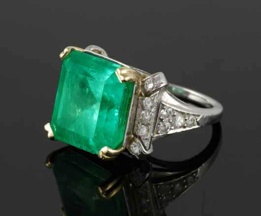 Women’s 18K gold, platinum and emerald ring, 14.25-carat emerald set with 18 round brilliant cut diamonds. Kaminski Auctions image
