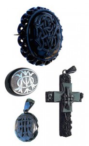 Clockwise from top: a rare Whitby jet monogrammed brooch spelling out the name Victoria in honor of the queen; a cross with the letters IHS representing the name of Jesus; a pendant carved with the initials AEI for amity, eternity and infinity, and a brooch with initials spelling ‘In memory of.’ Photo © Shire Publications 2009