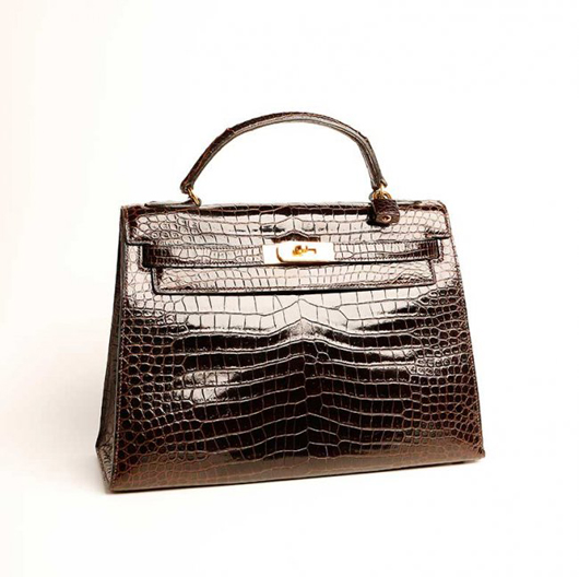 Lot 345 – Kelly bag by Hermès, dark brown crocodile, 1970s, September 2014 restoration certificate included. Estimate: €6,000-9,000. Courtesy Minerva Auctions