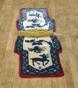 Old Chinese saddlebag rug, depicting a deer looking at a bird, wear and flaws noted, 59 in. long. Estimate: $150-$200. I.M. Chait Gallery/Auctioneers image