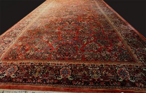Palace-size Persian rug with Sarouk design in pink, blue and navy, 24 feet 2 inches x 11 feet 11 ½ inches. Stevens Auction Co. image