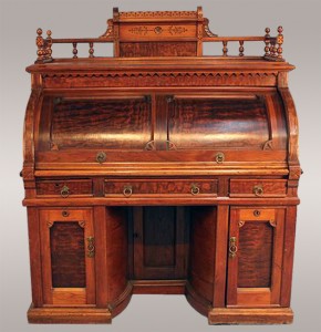 Walnut Wooton desk, signed, with swing-out doors. Stevens Auction Co. image