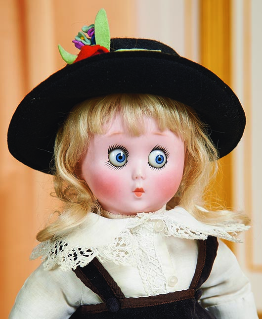 It cost $23,940 to buy this googly-eyed doll at a Maryland auction. It is 13 inches high, dressed in a period costume, and signed with the names of Oscar Hitt and George Borgfeldt and the date 1927