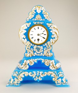 Nineteenth century blue opaline glass mantel clock, hand-painted with scrolling white and gilt designs. Estimate: $6,000-$8,000. Artingstall & Hind Auctioneers image