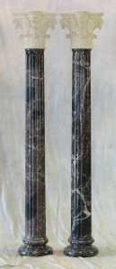 Pair of gray fluted marble columns, 20th century, with white carved capitals and plinth bases, 83in high. Bunch Auctions image