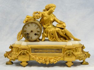 French Empire gilt metal mantel clock, 19th century, 12in high x 16 1/2in wide, lacking numerals 12, 5, 7. William Bunch Auctions image
