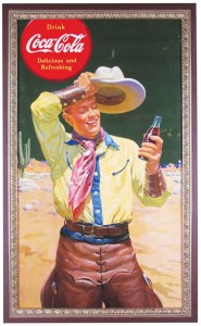 Rare Coca-Cola cardboard poster with cowboy image, one of over 50 Coke posters in the sale. Showtime Auction Services image