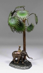 An Austrian cold-painted bronze electric table lamp modeled with an elephant and mahout beneath a palm tree. It measured 15 inches. Saleroom value: 700-1000 pounds. Photo The Canterbury Auction Galleries