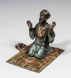 A late 19th century Franz Bergman cold-painted bronze figure of an Arab kneeling at prayer, his shoes set to the left, 3 1/4 inches. Sold for 520 pounds. Photo The Canterbury Auction Galleries