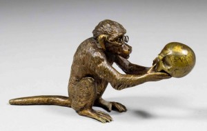 An amusing Austrian cold-painted bronze of a monkey wearing spectales and holding a skull – a jibe at Charles Darwin and his theories of evolution. Just three inches in height, it sold for 340 pounds. Photo The Canterbury Auction Galleries
