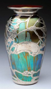 Silver-overlay art glass vase primarily in peacock blue, est. $1,500-$2,500. Morphy Auctions image